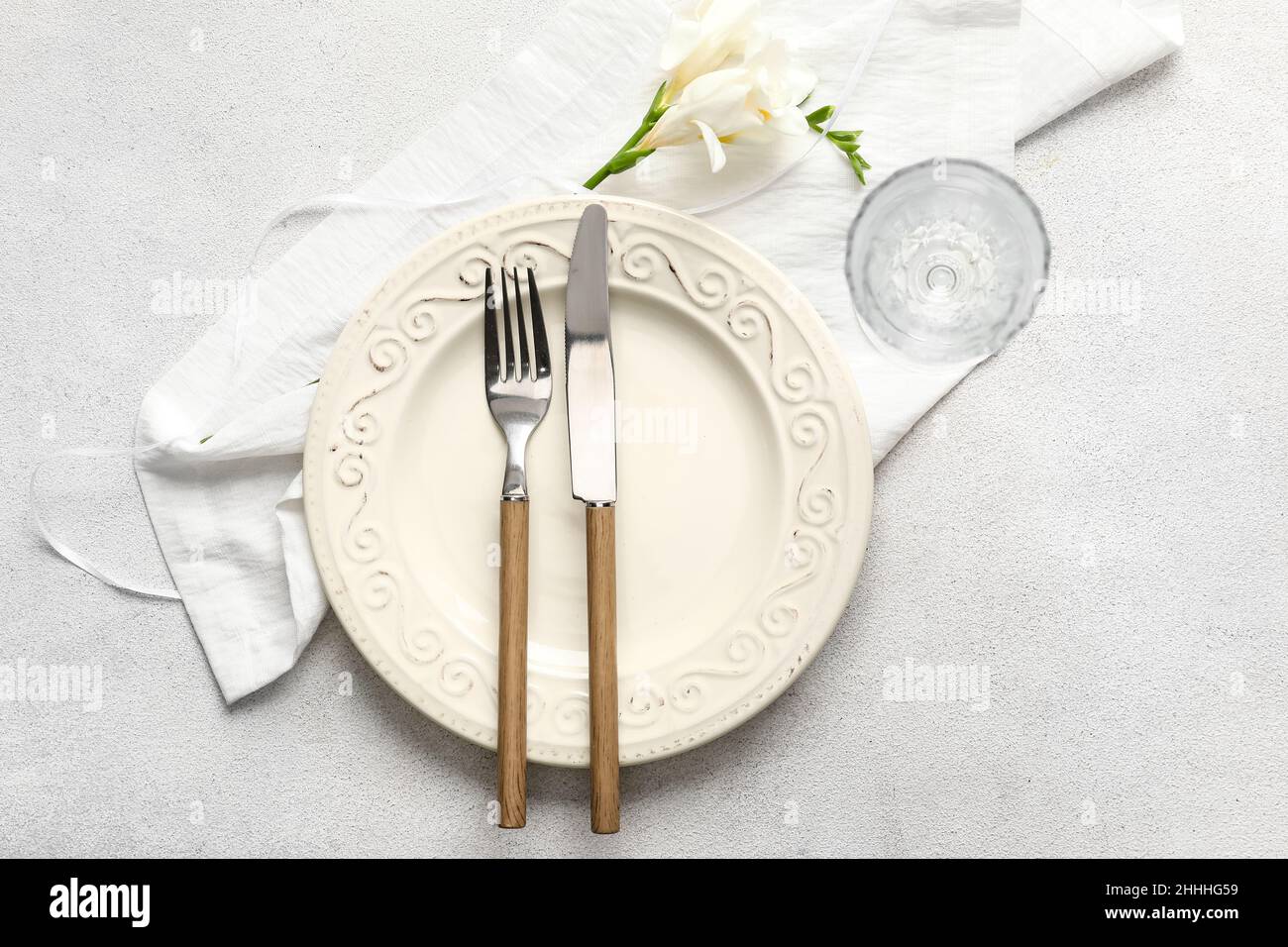 Beautiful table setting for wedding on light background Stock Photo - Alamy