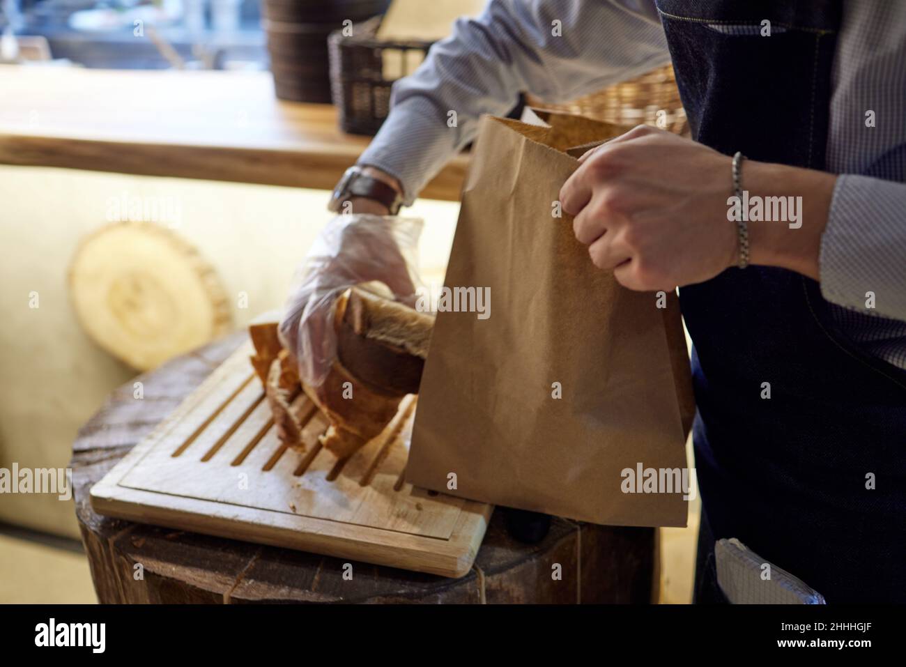 Bakery, bread in paper bag on rustic wood background, grocery concept ...