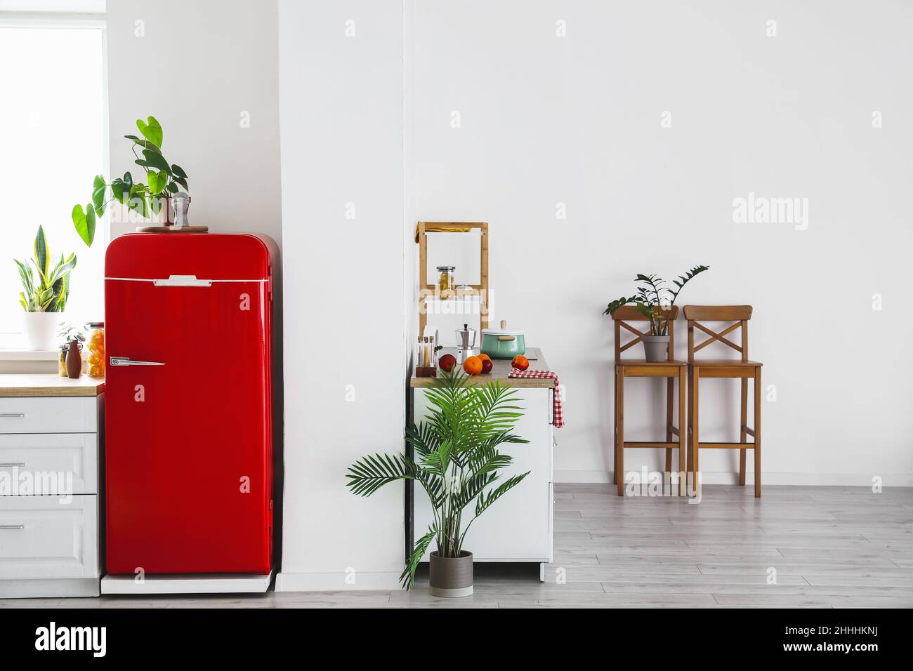 Interior of modern kitchen with stylish refrigerator, counters and ...