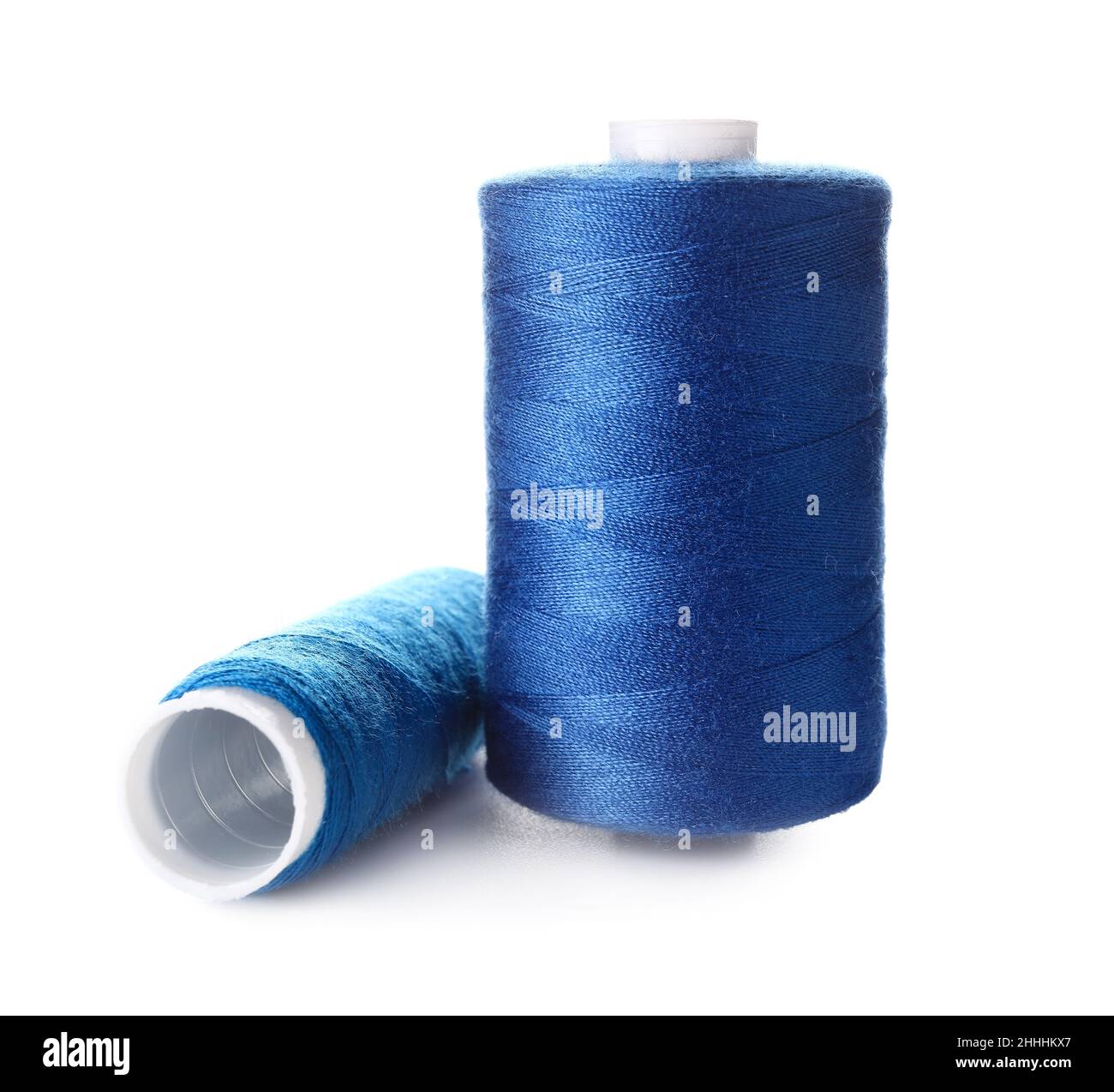 Blue String Spool Blue sewing thread spools on white background Stock Photo - Alamy