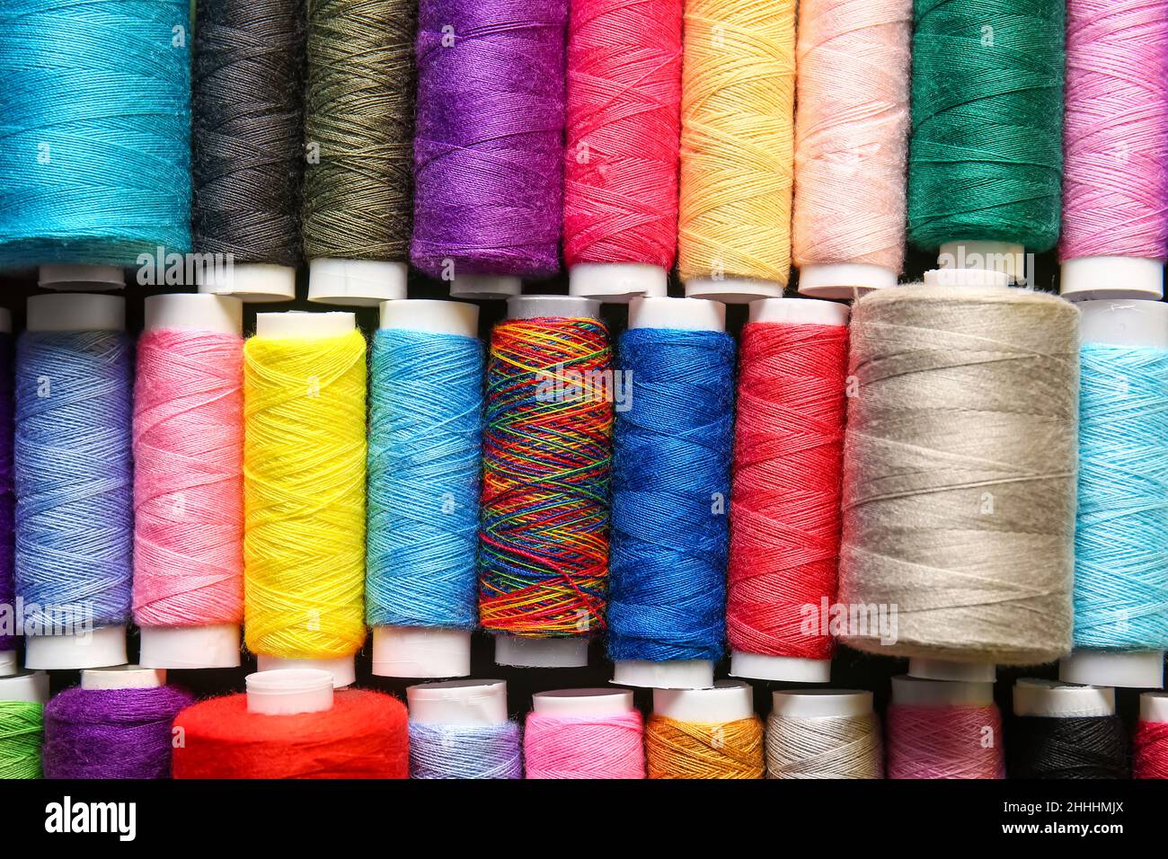 Set of spools with different sewing threads, closeup Stock Photo - Alamy