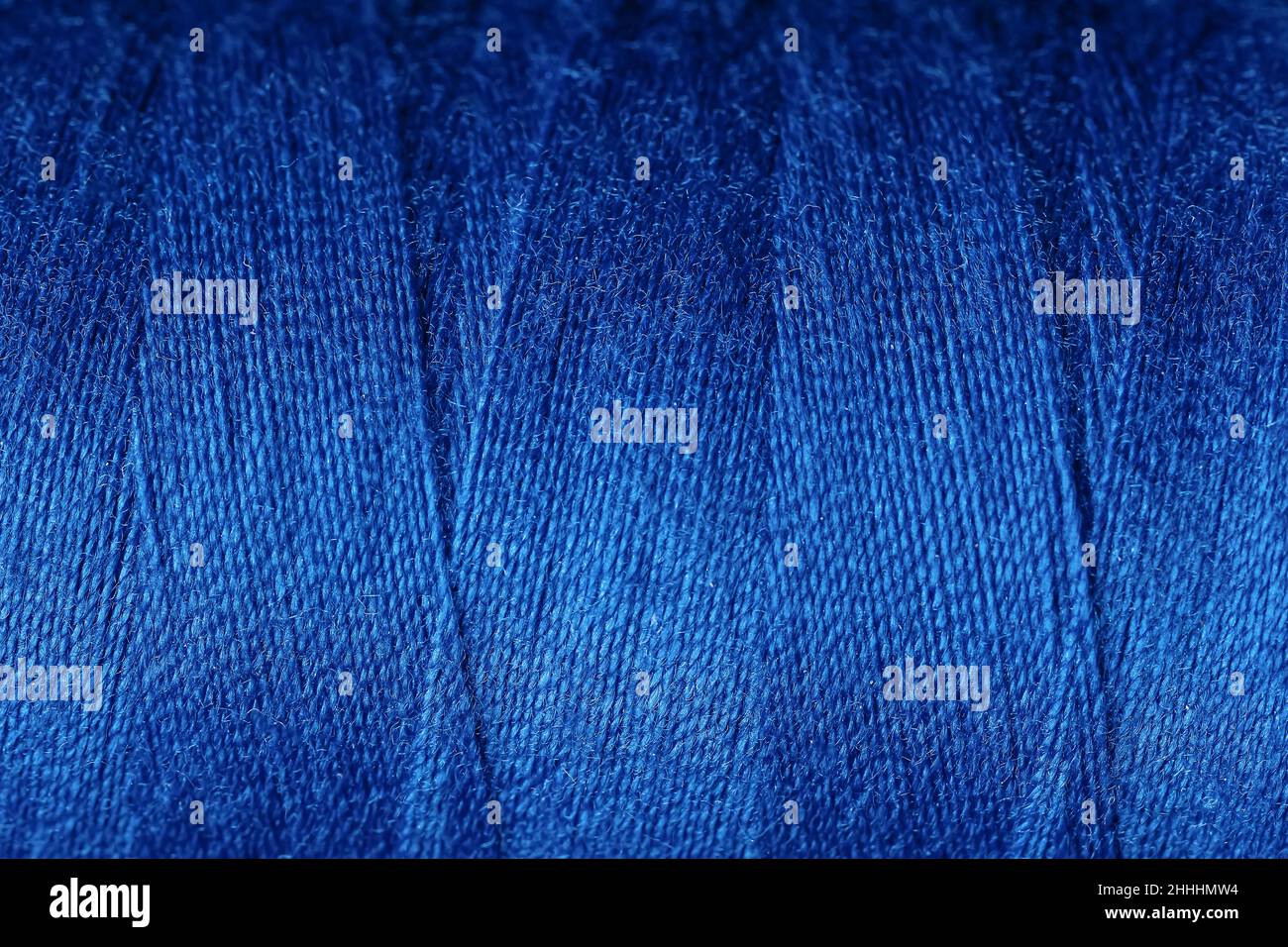 Closeup view of blue threads as background Stock Photo - Alamy