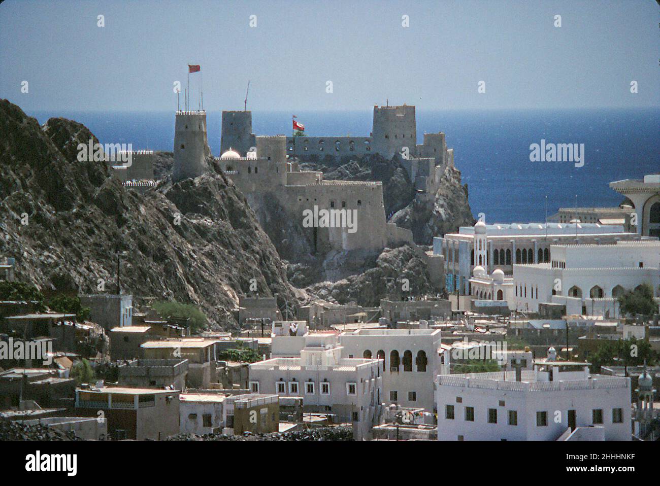 Al Mirani Fort -16th century Portuguese, and Al Alam, the Sultan's Palace, Muscat, Oman, May 1978 Stock Photo