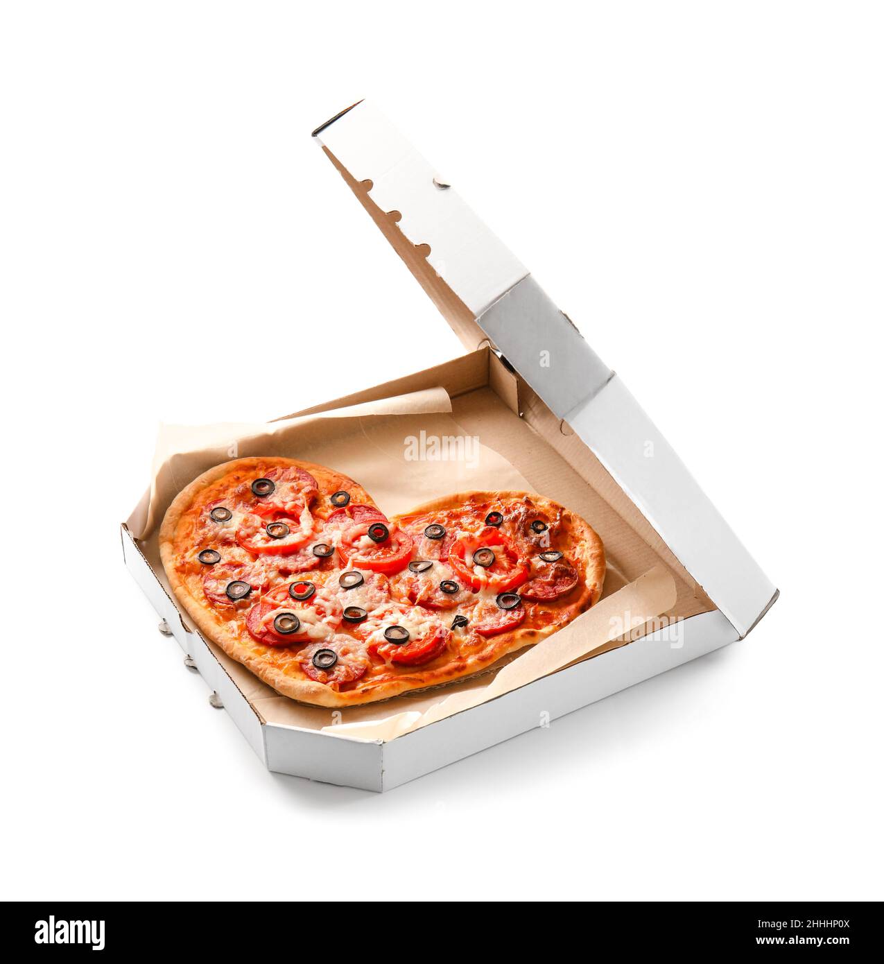 Cardboard box with tasty heart-shaped pizza on white background