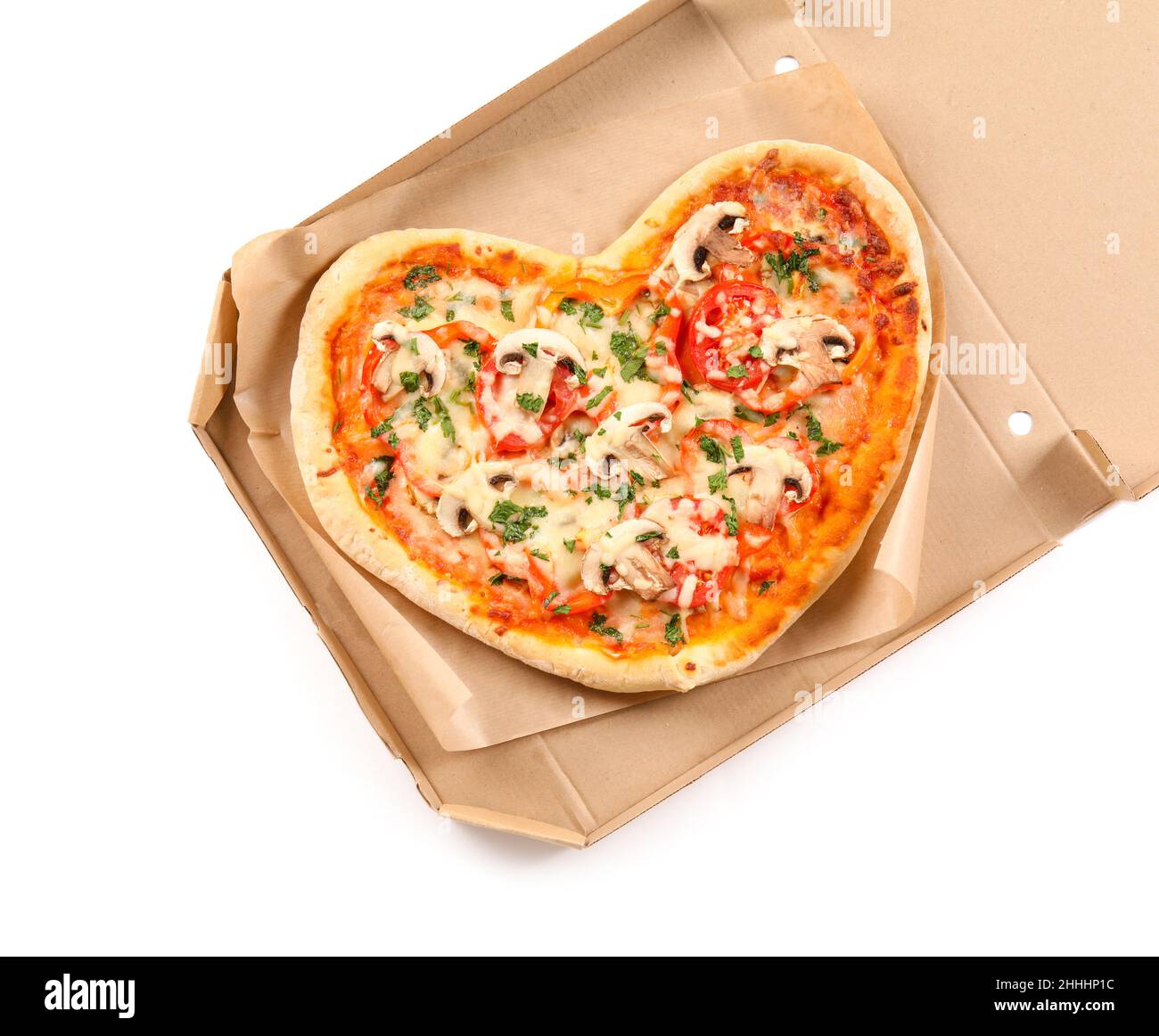 Cardboard box with tasty heart-shaped pizza on white background