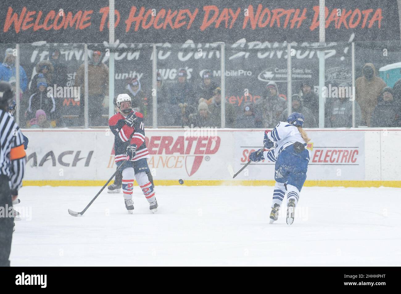 Bismarck Blizzard defender Bauer Ackerman (11) gets in the way of a shot from a Jamestown Blue Jay player during the 3rd annual Hockey Day North Dakota outdoor hockey event in Jamestown, ND. Youth, high school and college hockey teams from around North Dakota competed over two days. By Russell Hons/CSM Stock Photo