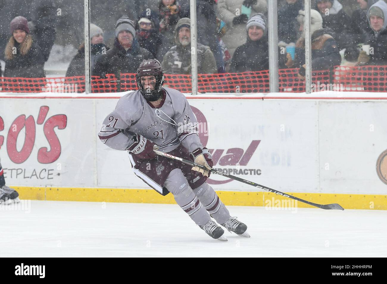 Grand Forks Central Knights skater Rylan Hoffman (21) watches for a pass as the crowd looks on during the 3rd annual Hockey Day North Dakota outdoor hockey event in Jamestown, ND. Youth, high school and college hockey teams from around North Dakota competed over two days. By Russell Hons/CSM Stock Photo