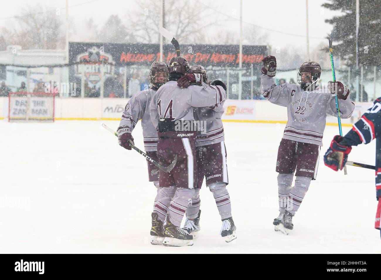Members of the Grand Forks Central Knights celebrate after scoring a goal during the 3rd annual Hockey Day North Dakota outdoor hockey event in Jamestown, ND. Youth, high school and college hockey teams from around North Dakota competed over two days. By Russell Hons/CSM Stock Photo