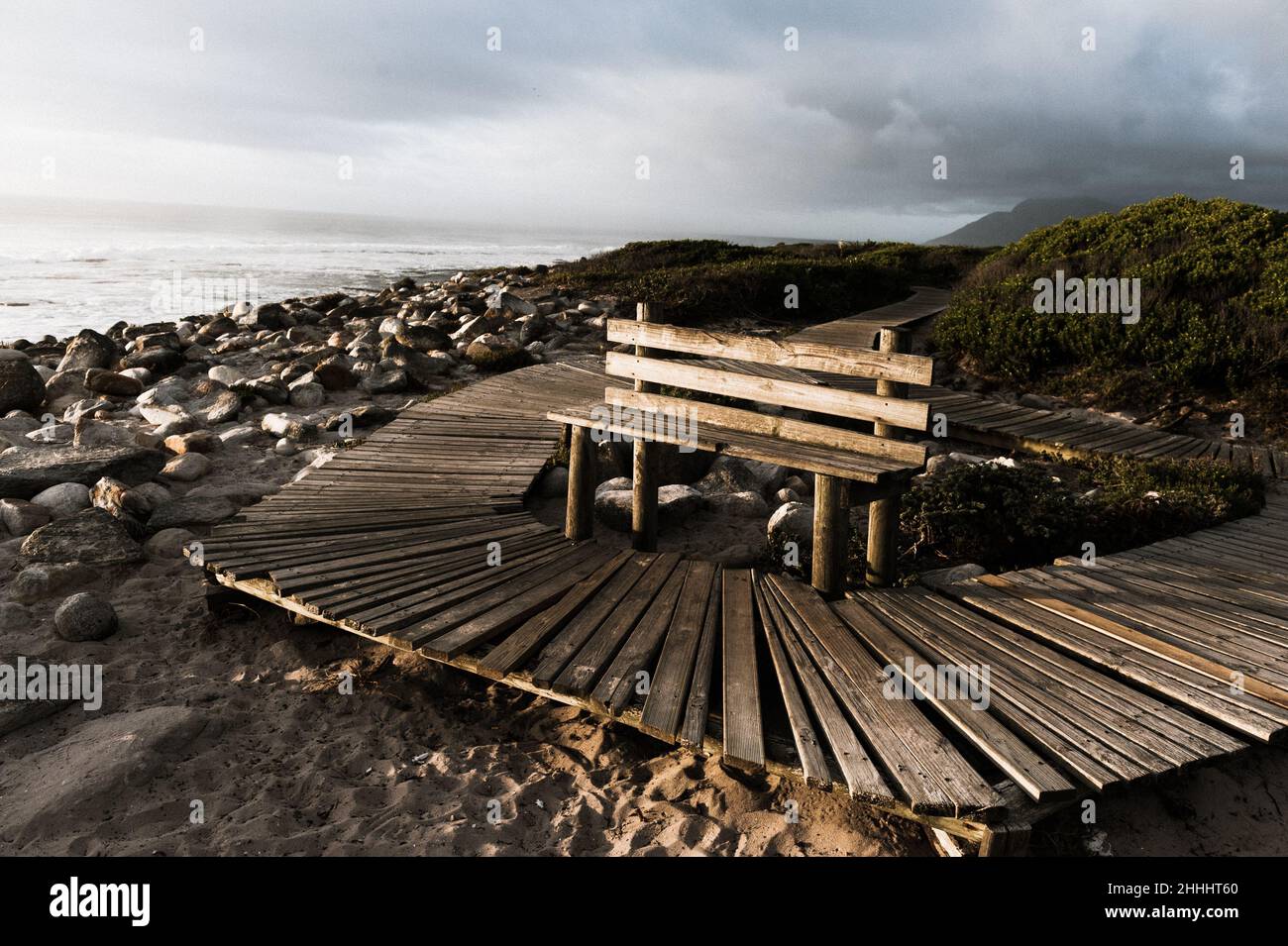A roughly hewn boardwalk in the small Cape Peninsula town of Kommetjie on the South African Atlantic seaboard near Cape Town Stock Photo