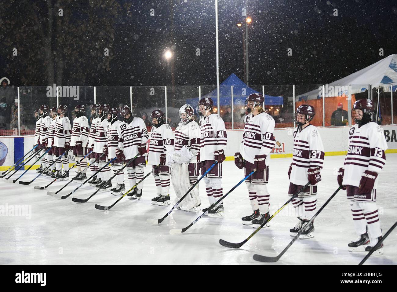 Bismarck High Demons line up before their game against the Grand Forks Red River Roughriders during the 3rd annual Hockey Day North Dakota outdoor hockey event in Jamestown, ND. Youth, high school and college hockey teams from around North Dakota competed over two days. By Russell Hons/CSM Stock Photo