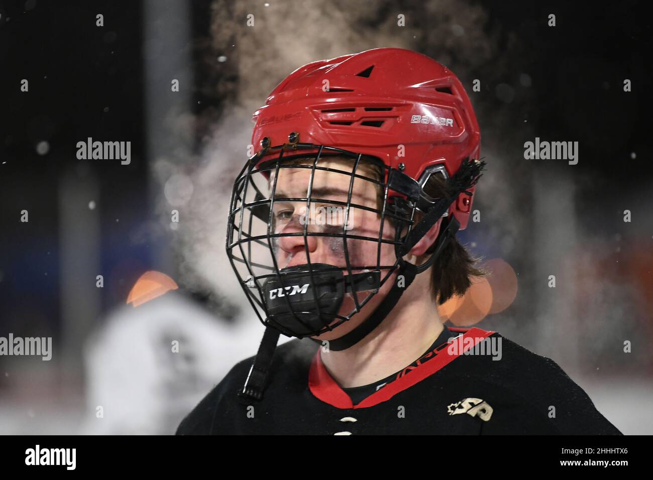 Grand Forks Red River Roughriders skater Carter Sproule (21) heads to the bench during the 3rd annual Hockey Day North Dakota outdoor hockey event in Jamestown, ND. Youth, high school and college hockey teams from around North Dakota competed over two days. By Russell Hons/CSM Stock Photo