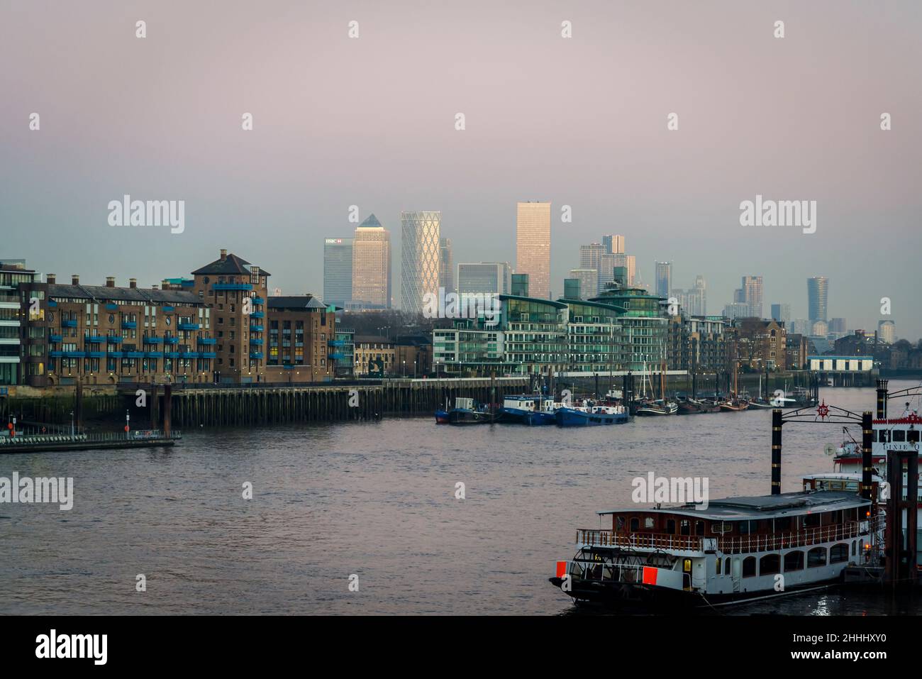 View of the Canary Wharf and River Thames from Tower Bridge at sunset ...