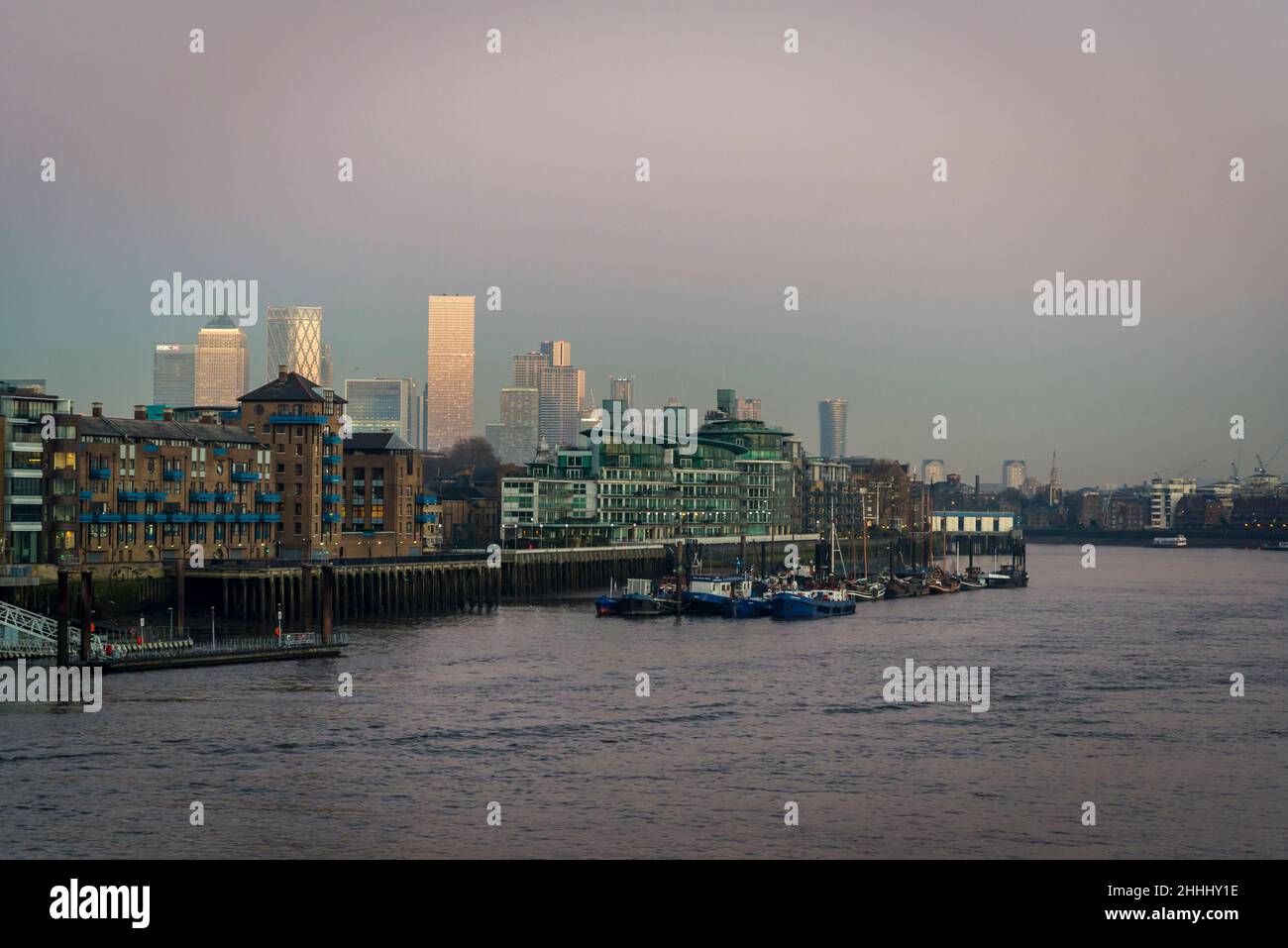 View of the Canary Wharf and River Thames from Tower Bridge at sunset ...