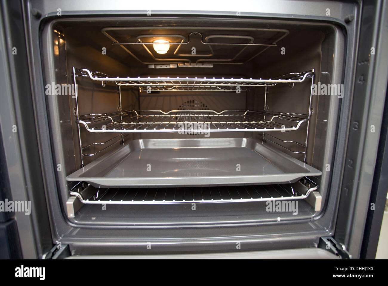 Empty oven with door open Stock Photo