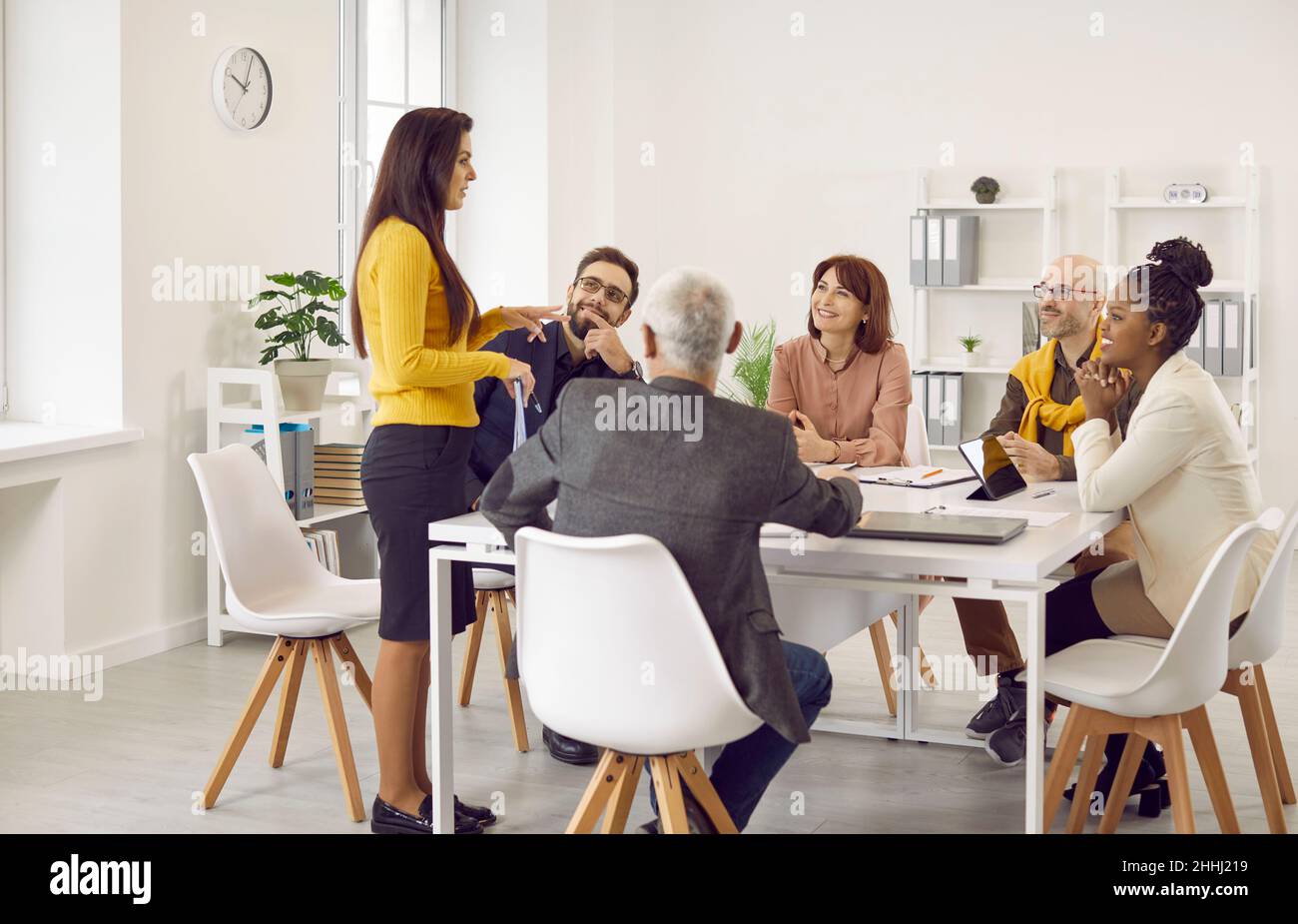 Multiracial team of business people having a work meeting around the office table Stock Photo