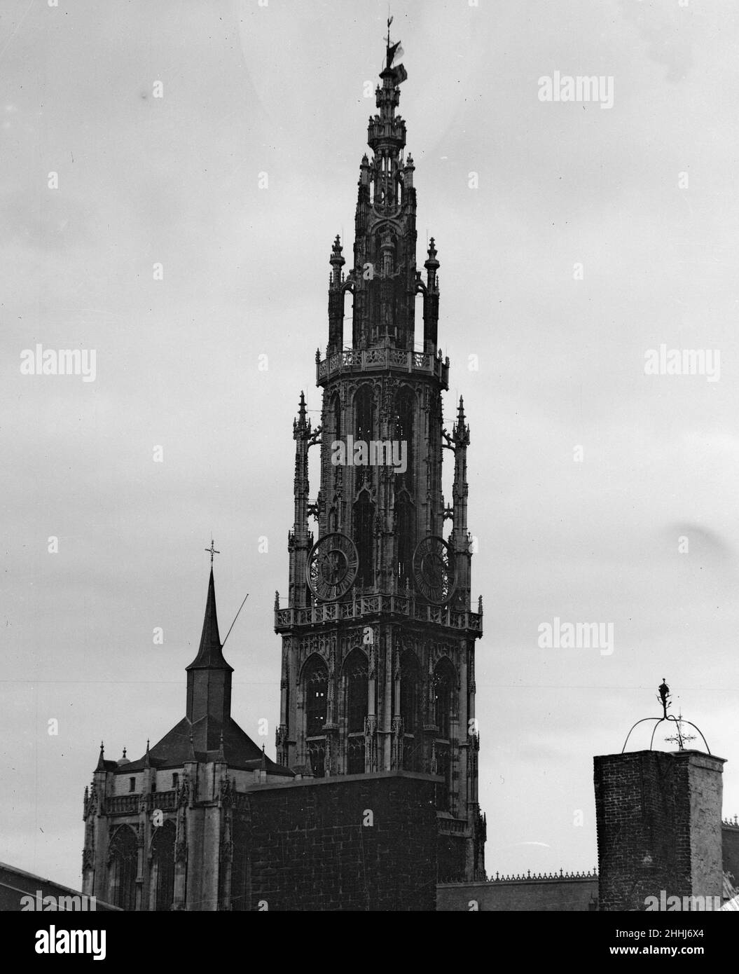 German Bombardment of Antwerp October 1914 Antwerp Cathedral flying the flag of the Geneva Convention above the Belgian national flag . Stock Photo