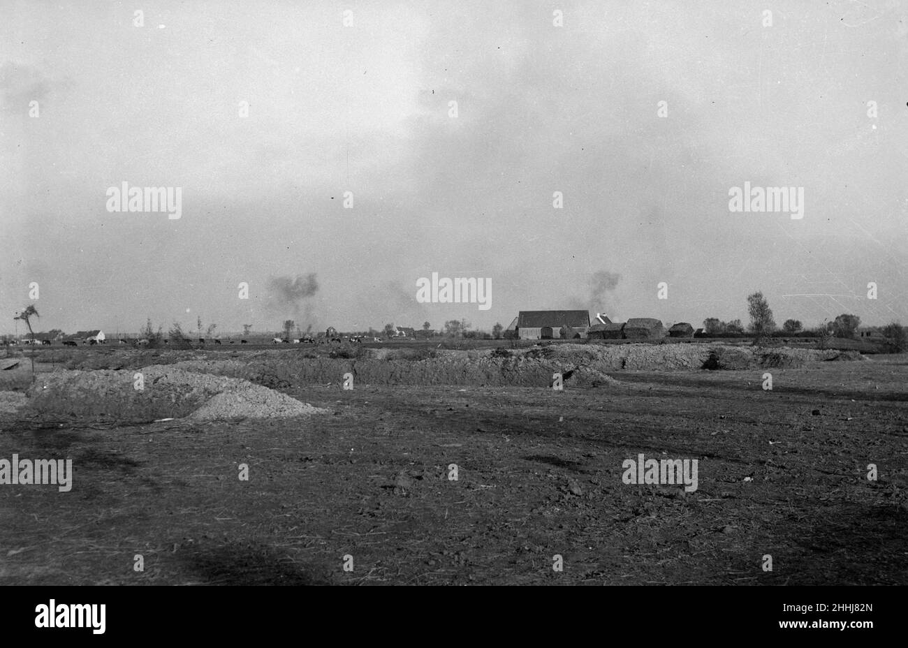 Shells bursting over the battlefield close to  Diksmuide during the Battle of  the Yser, Belgian army trenches can be seen in the foreground . Circa October 17th 1914 Stock Photo