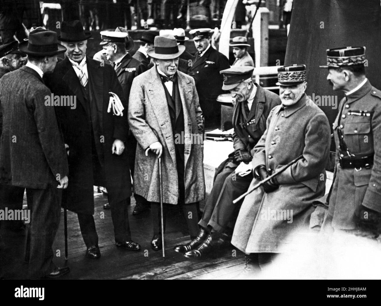 Left to right, David Lloyd George (standing, facing camera with walking stick), Gen. Sir Henry Wilson and Marshall Ferdinand Foch (with cane under arm) en route for the supreme war council. 1918. Stock Photo
