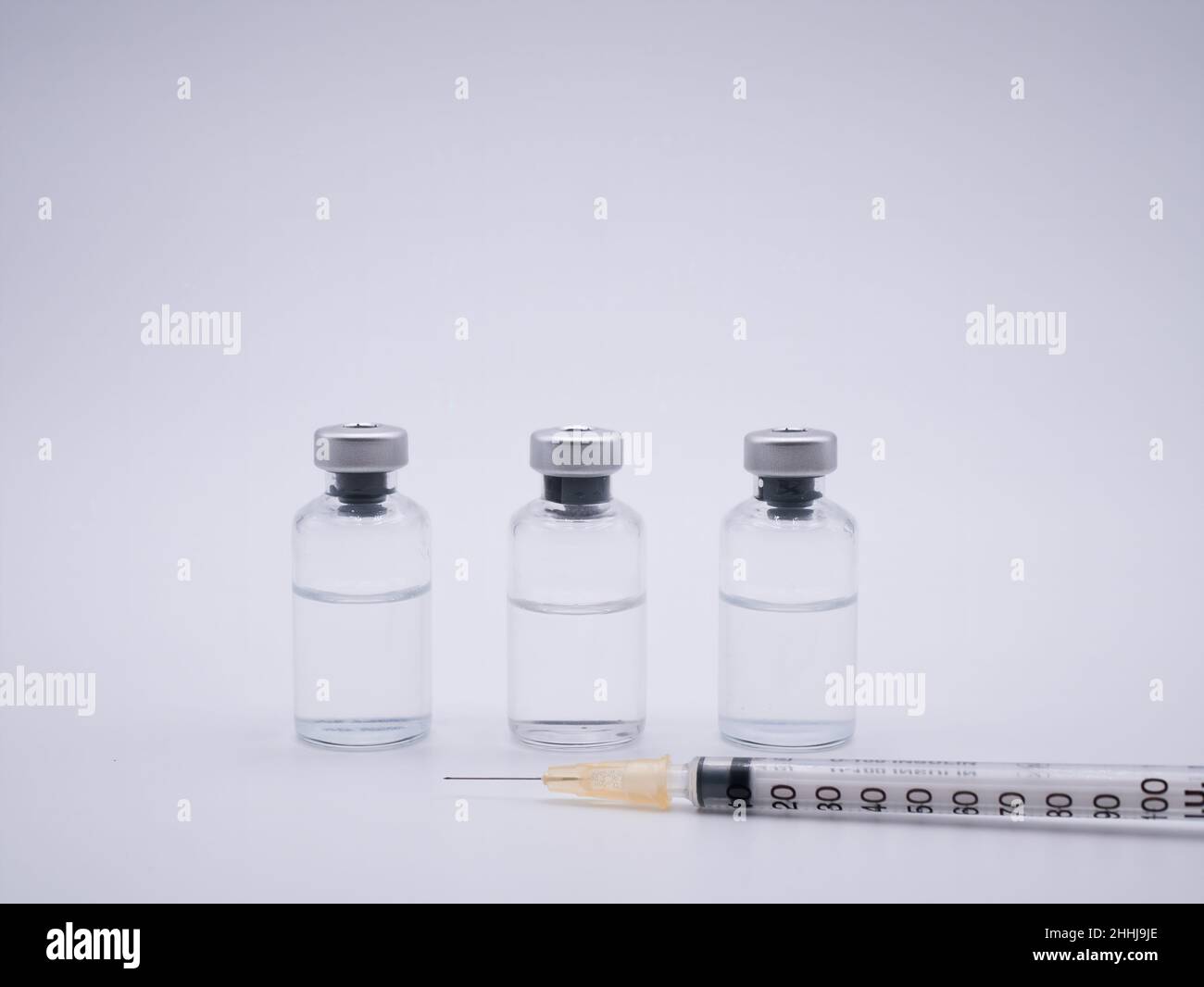 Vaccine containers and syringe isolated on white background Stock Photo ...