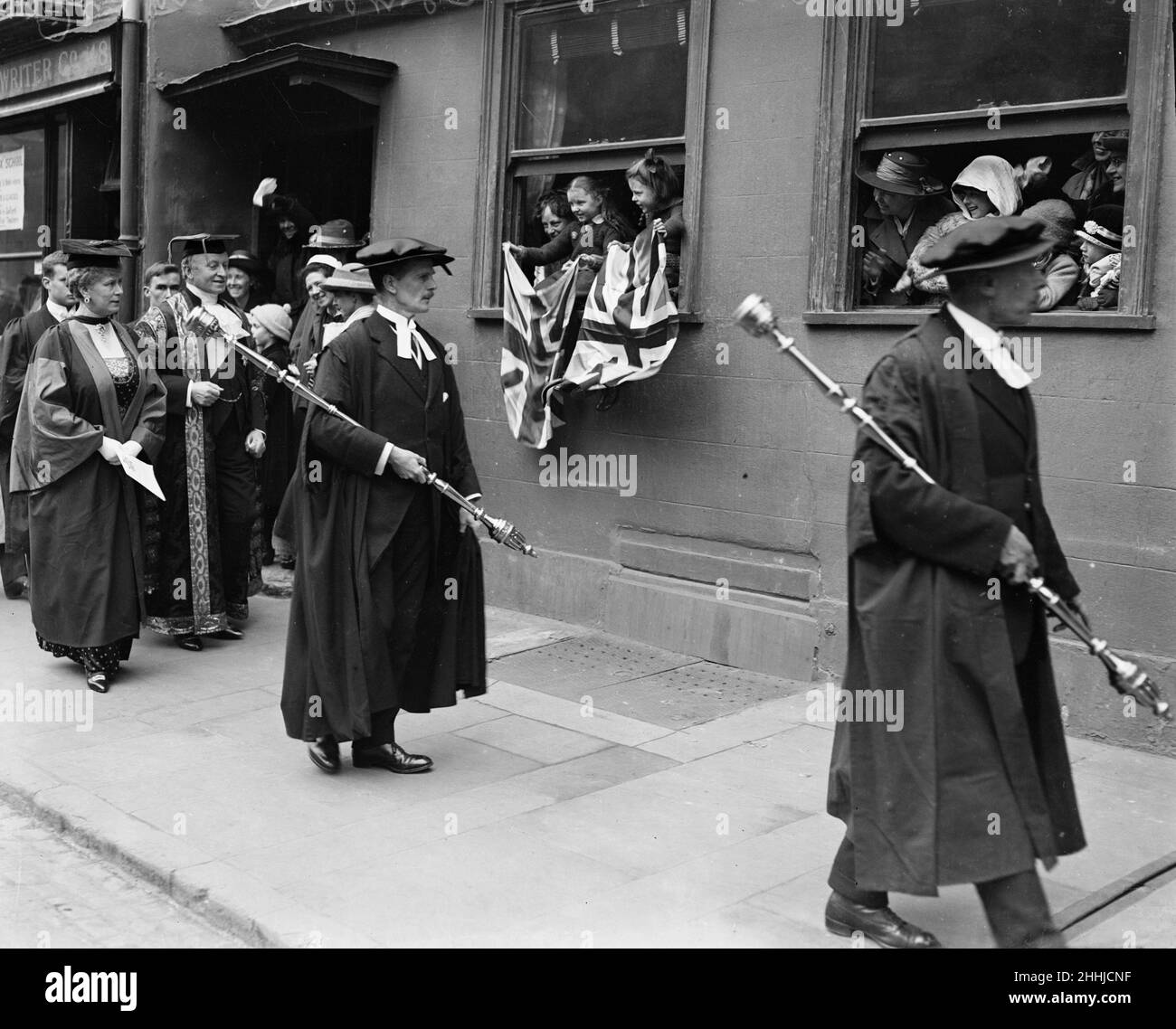 Queen Mary receives a degree of D.C.L. at Oxford University walking alongside the queen is Lord Curzon. 12th March 1921.DH9300A Stock Photo