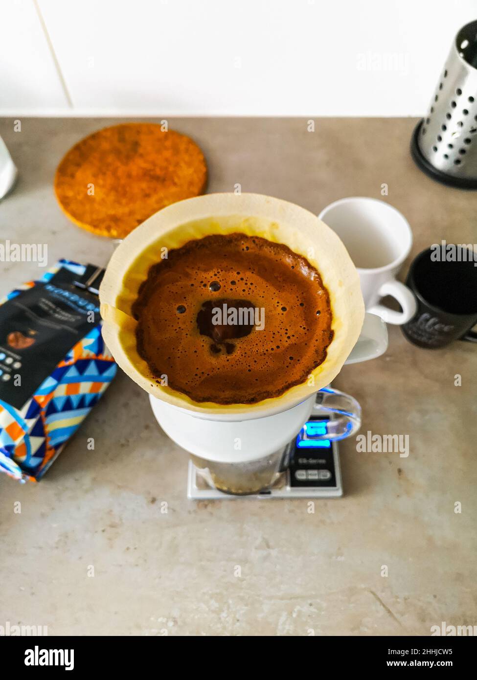 Preparing a pot of black filtered coffee by dripper v60 Stock Photo