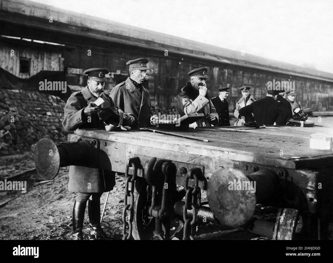 King George V, King Albert of Belgium and several staff officers stop for an impromptu lunch on a railway truck at Zeebrugge, France, Daily Mirror 18th December 1918. Published Photograph. World War One. Stock Photo