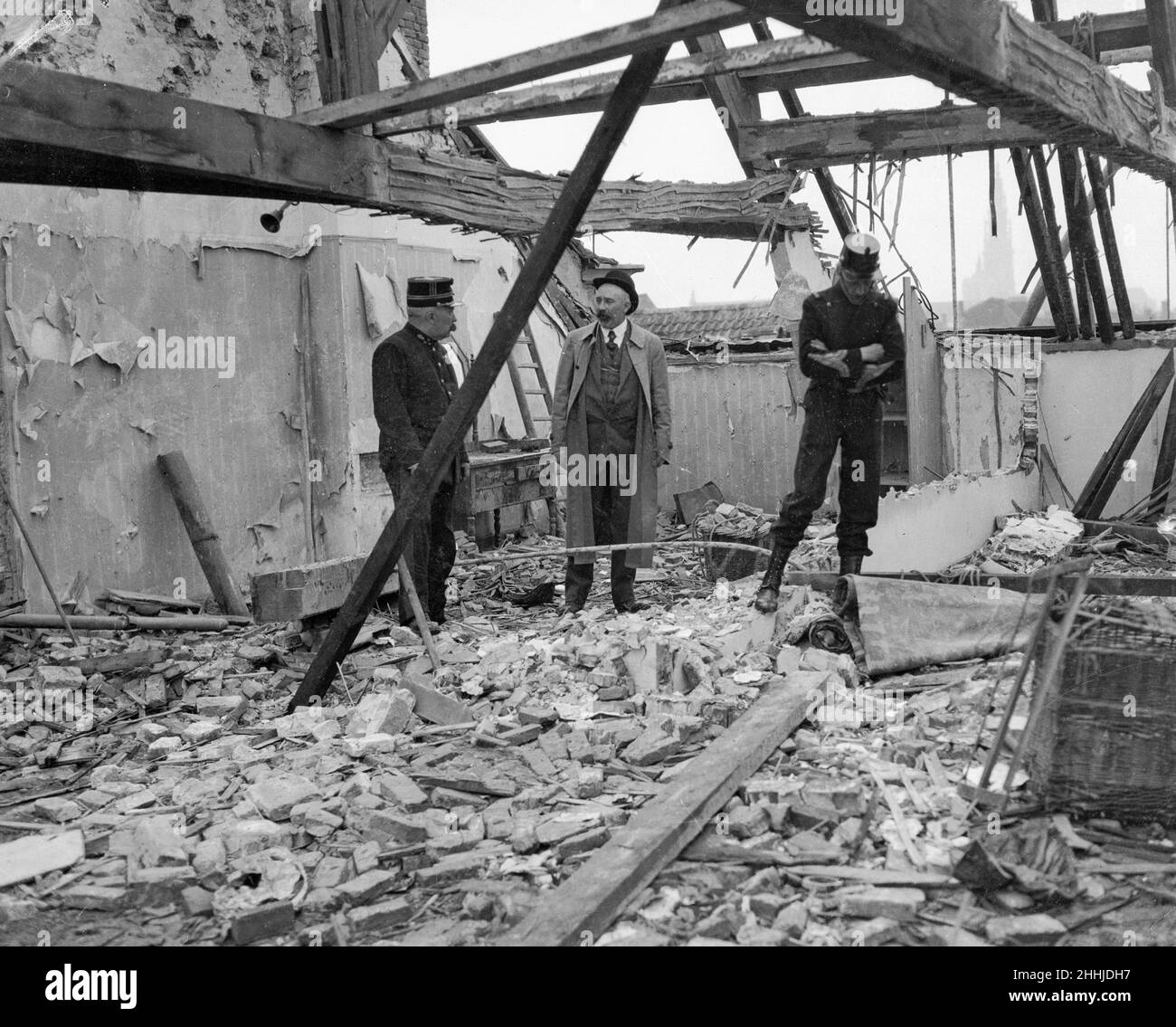 Belgian Army officers inspect  telegraph/radio office damaged  in Antwerp the result of one of the three air raids made on the city by German Zeppelin airships in late August 1914. Stock Photo