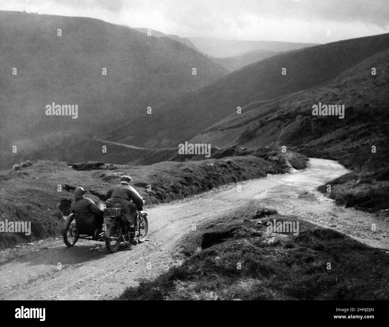 Motorcycle and sidecar competing in the Liverpool Motor Club Reliance Cup descending down the Chase Shall Pass to Llangollen, 3rd September 1923 Stock Photo