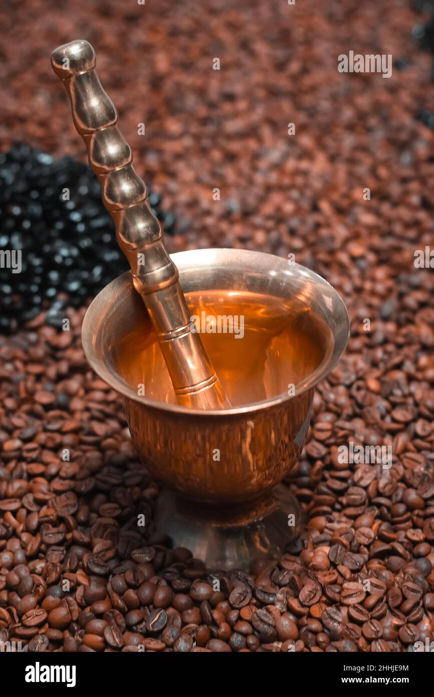crusher coffee mortar and pestle with coffee beans Stock Photo Alamy