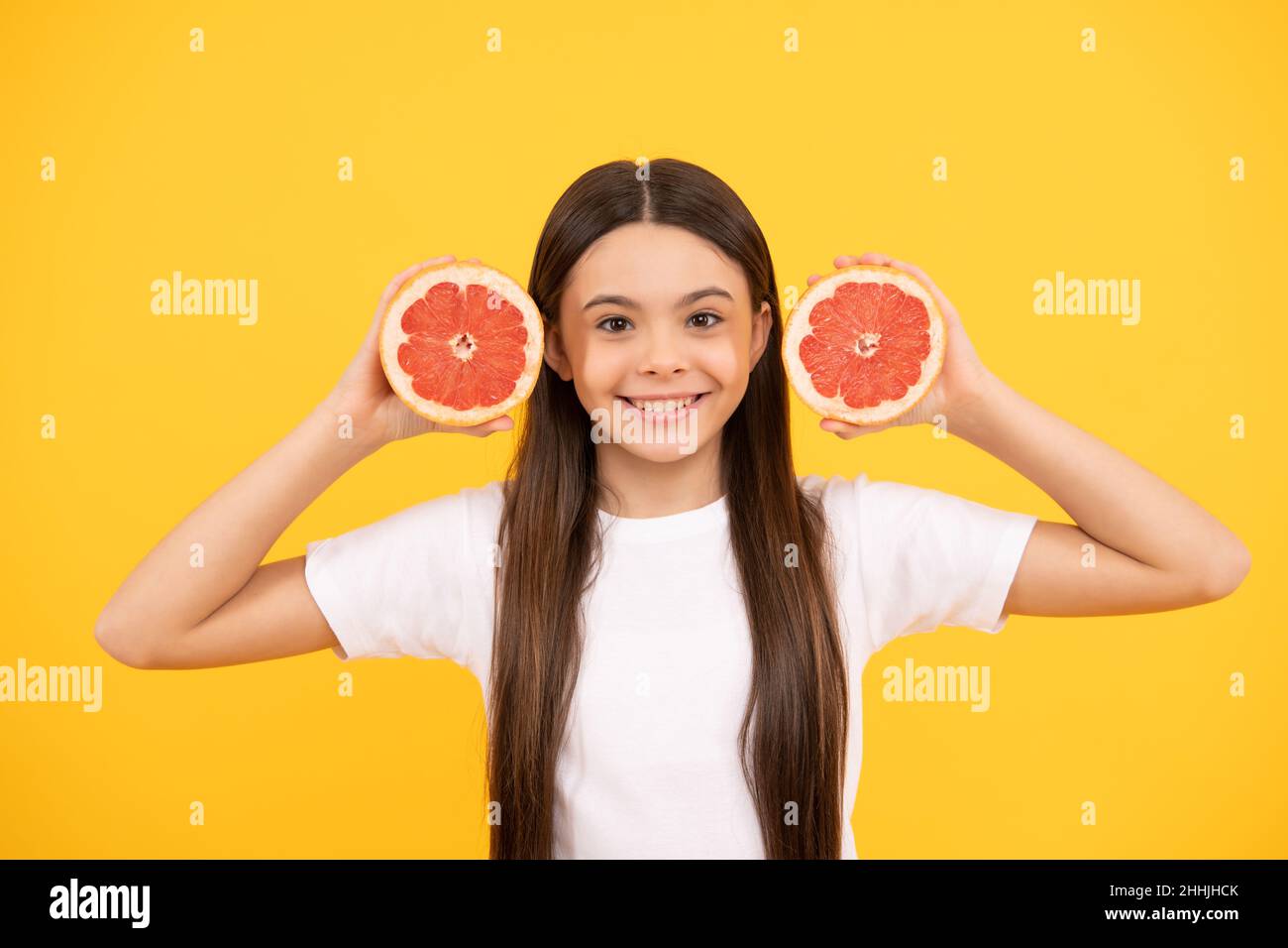 healthy life. diet and kid skin beauty. smiling teen girl with grapefruit. vitamin and dieting. Stock Photo