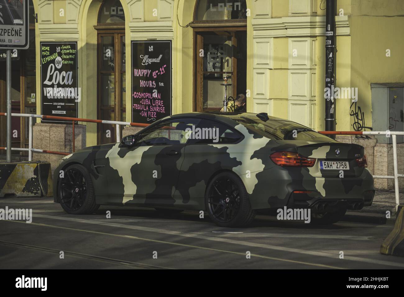 Stunning camouflage painted black car BMW F82 Stock Photo - Alamy