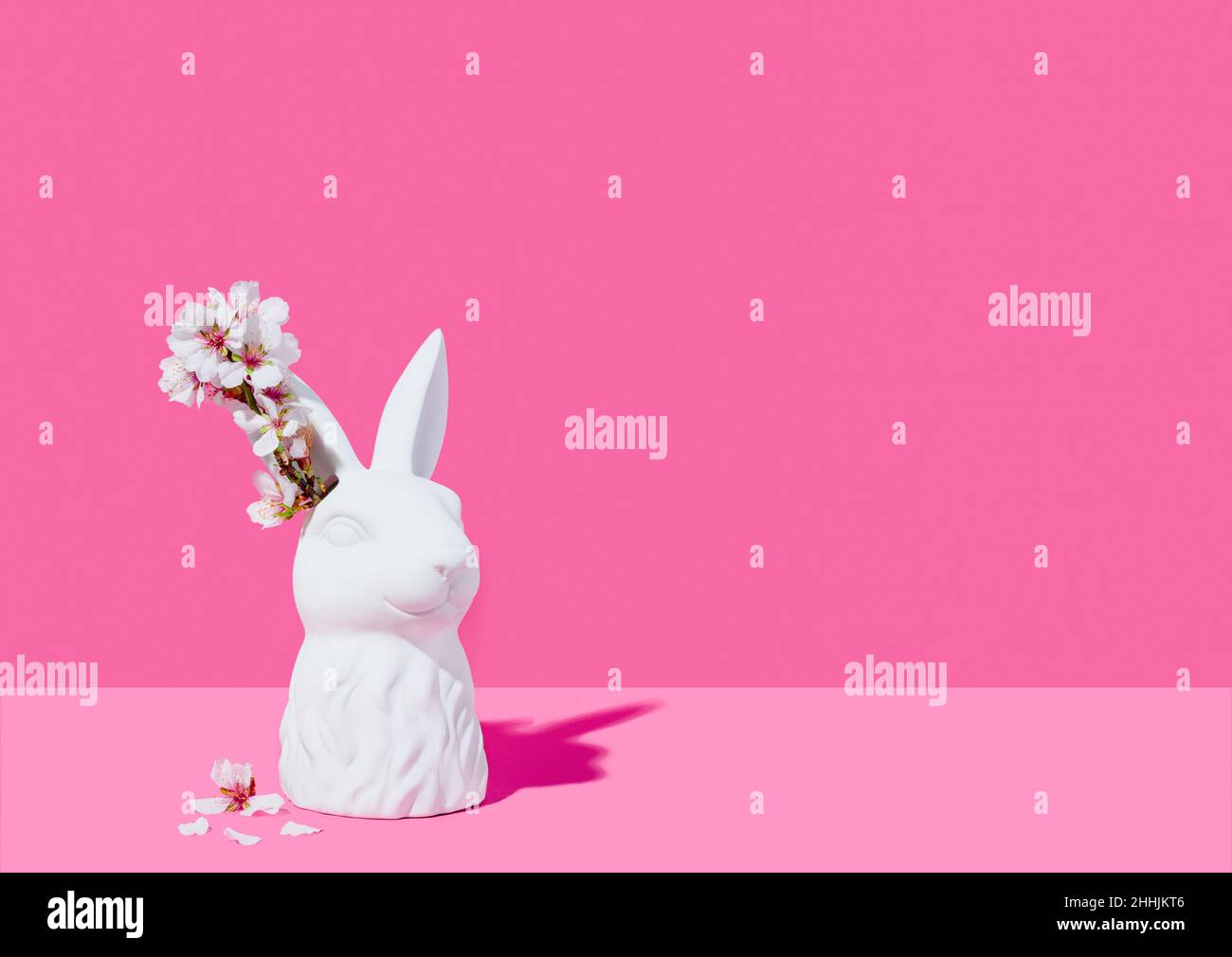 Bust of a white rabbit with almond blossoms on a pink background Stock ...