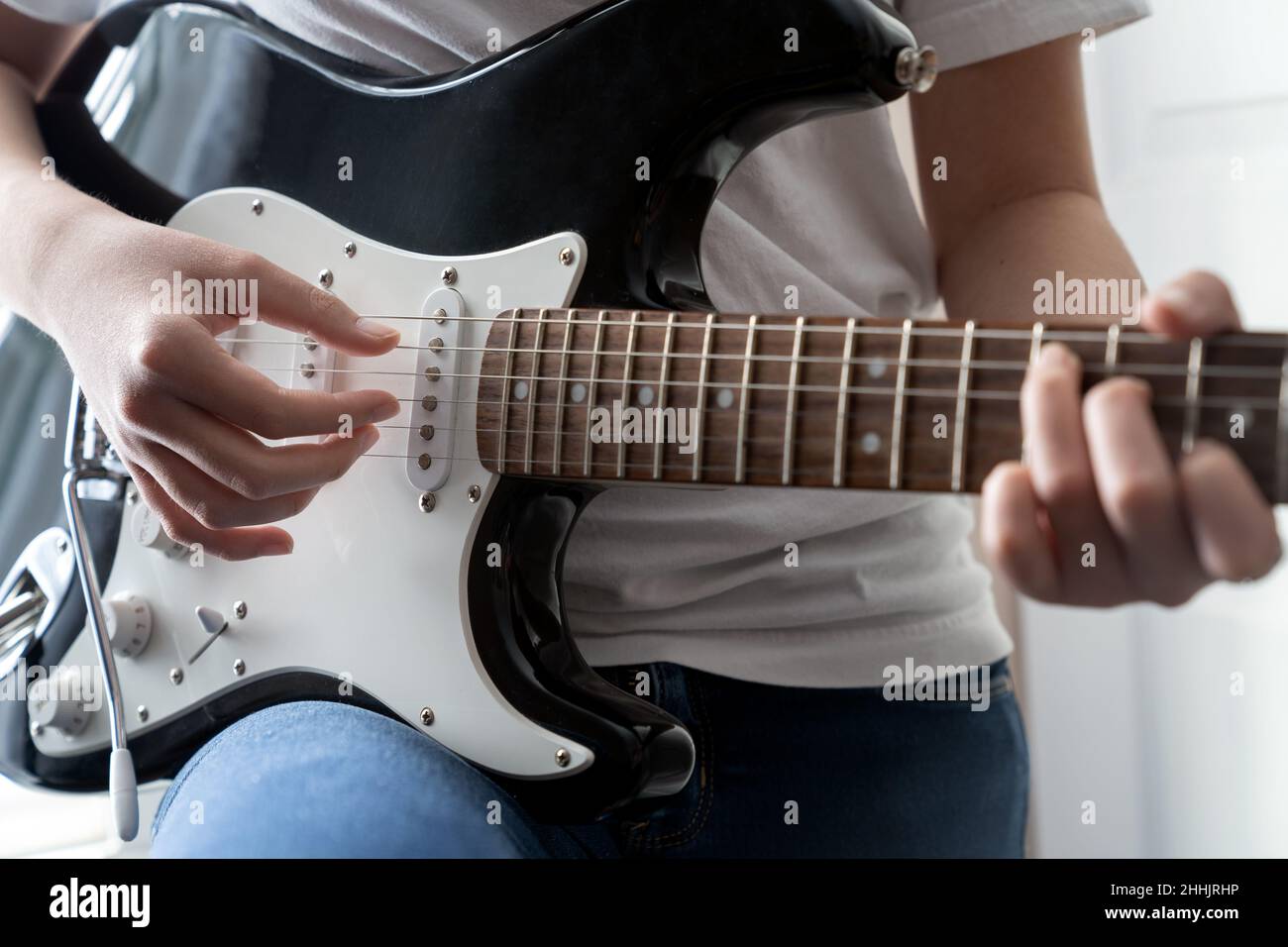 Young girl playing electric guitar Stock Photo Alamy