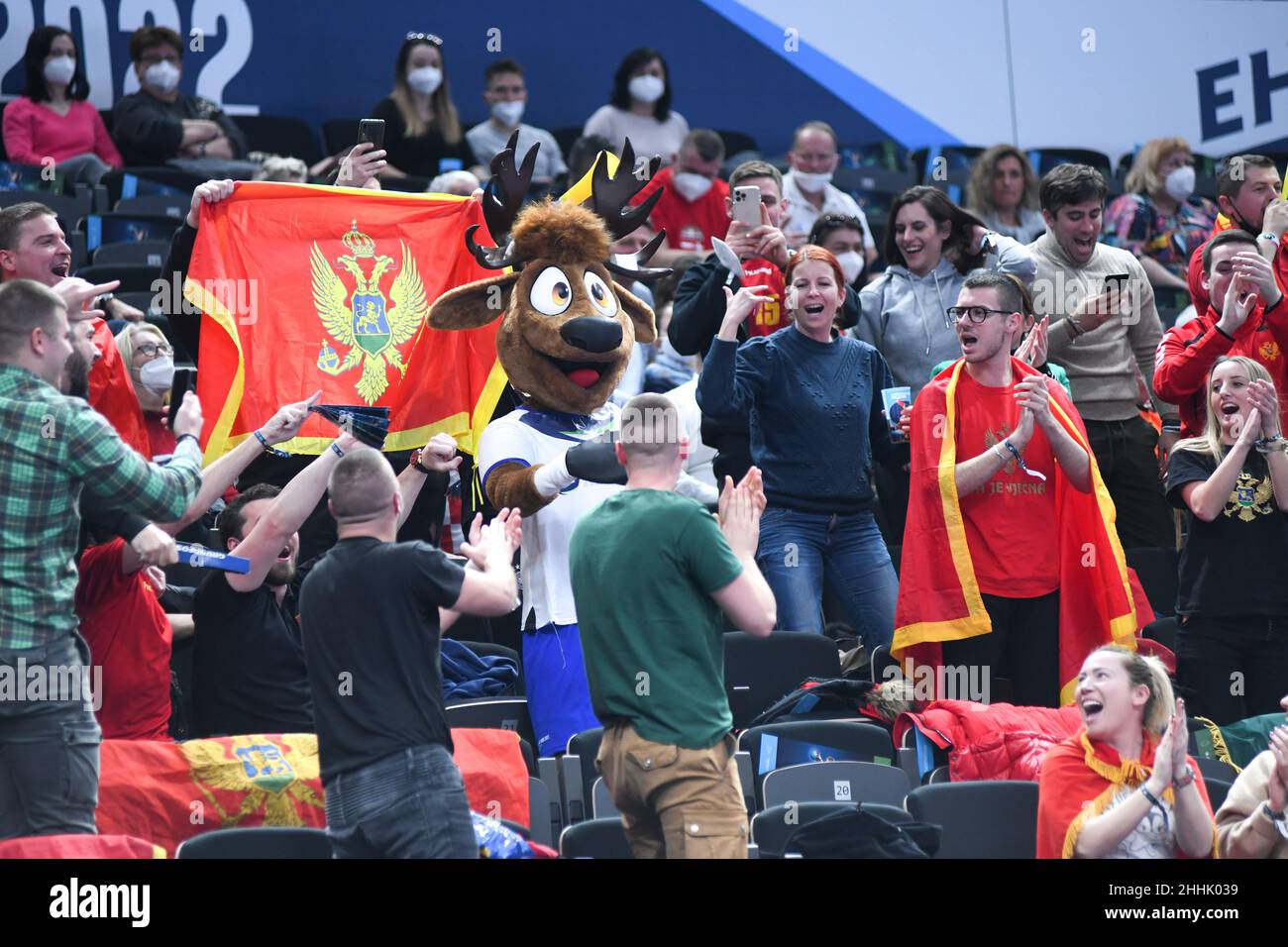 EHF Euro 2022: Montenegrin fans celebrating with the official mascot of the tournament Stock Photo