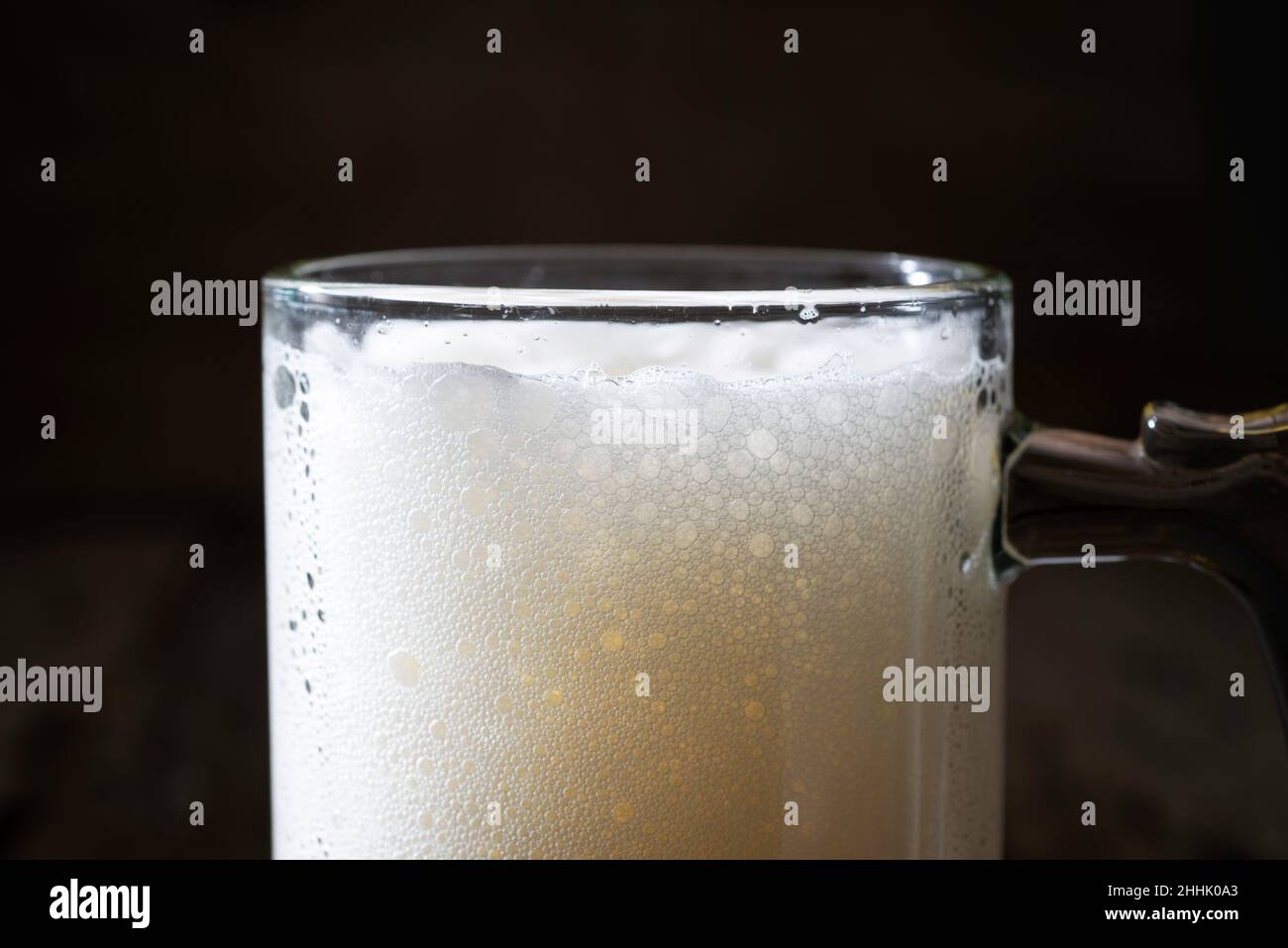 a mug of beer on a dark background Stock Photo