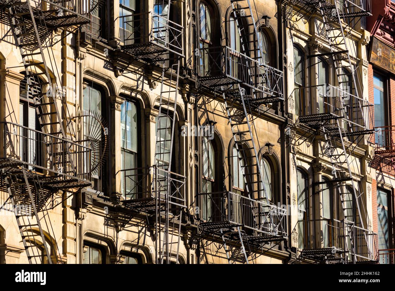 Typical Soho loft building facades with fire escapes. Manhattan, New York City Stock Photo
