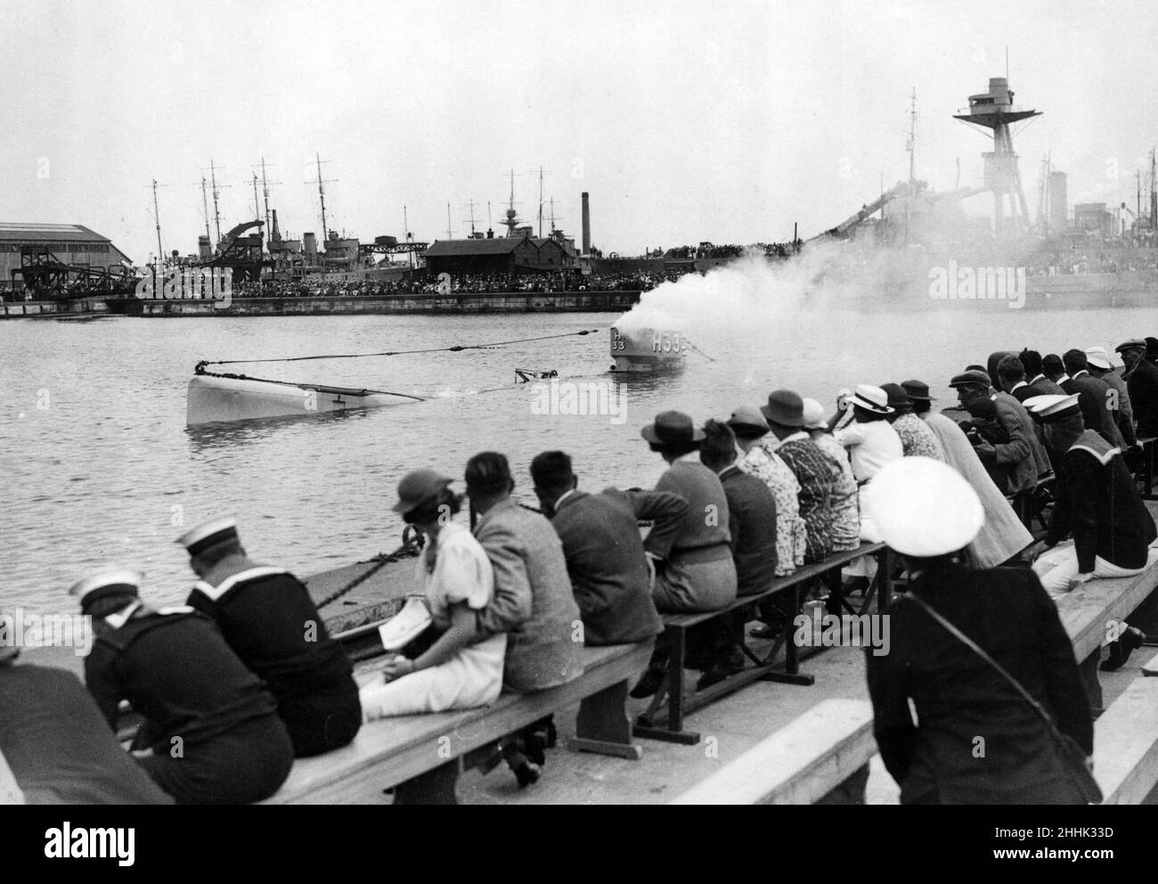 Navy week opened at various Naval ports. Here is a typical picture form Chatham, Kent, with 'Enemy' submarine sinking after a 'Q' boat demonstration. Circa 1930. Stock Photo