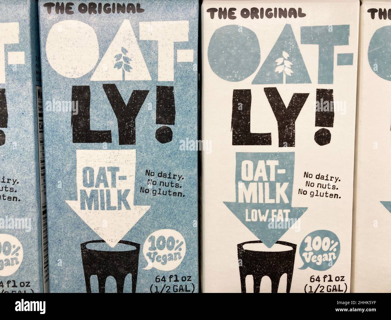 Oat-Ly brand original and low fat oat milk cartons on shelf of diary section of grocery store - San Jose, California, USA - 2022 Stock Photo