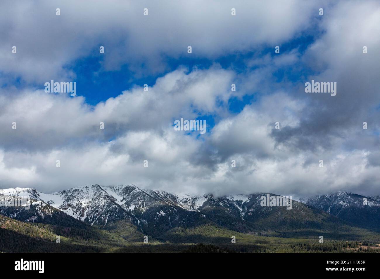 USA Idaho Ketchum Clouds over snowcapped Boulder Mountains Stock