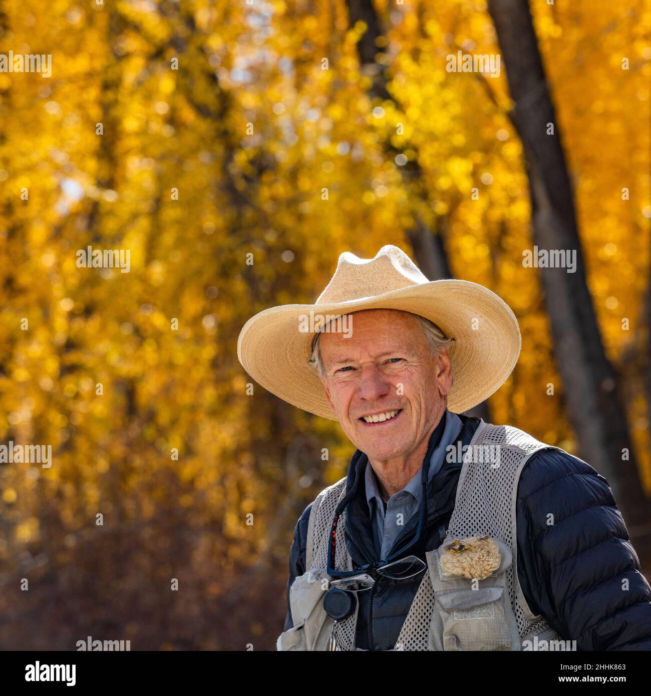 Portrait of smiling senior fisherman Stock Photo