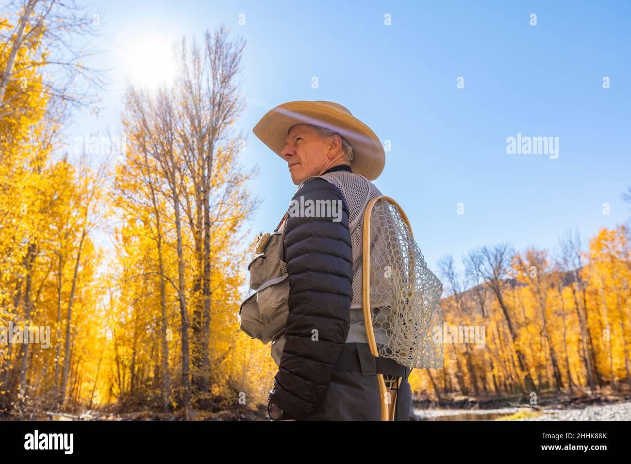 USA, Idaho, Bellevue, Senior fisherman in Autumn landscape Stock Photo