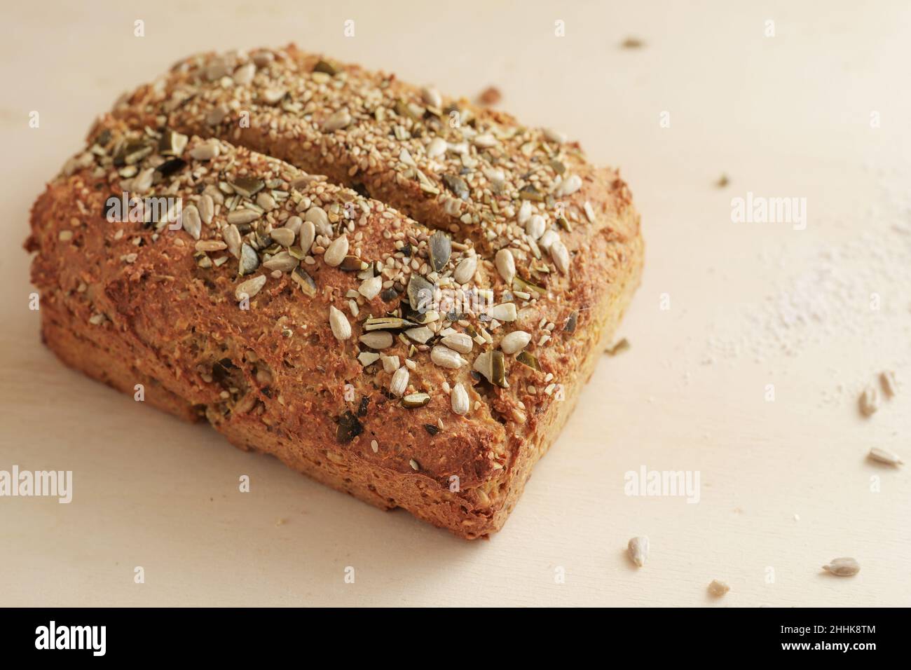 Healthy whole grain bread with seeds and kernels, homemade baking with protein and fiber for a low carb diet, copy space, selected focus, narrow depth Stock Photo