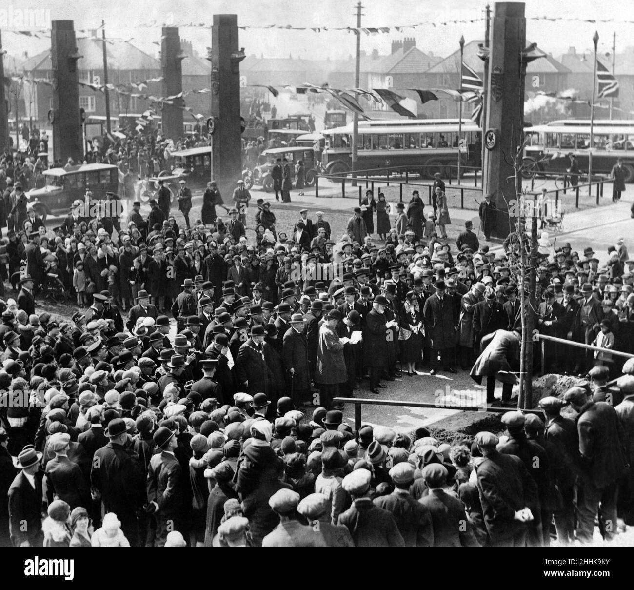 Alderman Muirhead plants a commemorative tree at the opening of the