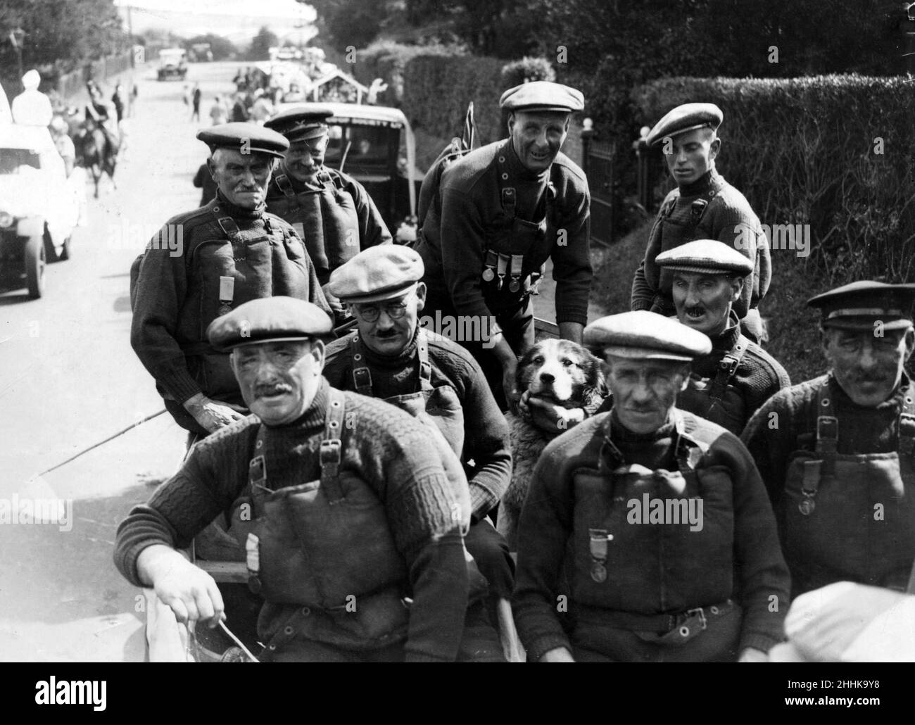 The Cromer lifeboat crew and the dog, Monte, they saved some years ago. They are H.T Davies, H.G Blogg, E. Waller, G. Balls, W.T Davies, G. Allen, G. Mayes, R. Davies, C. Cox. 6th September 1933. Stock Photo