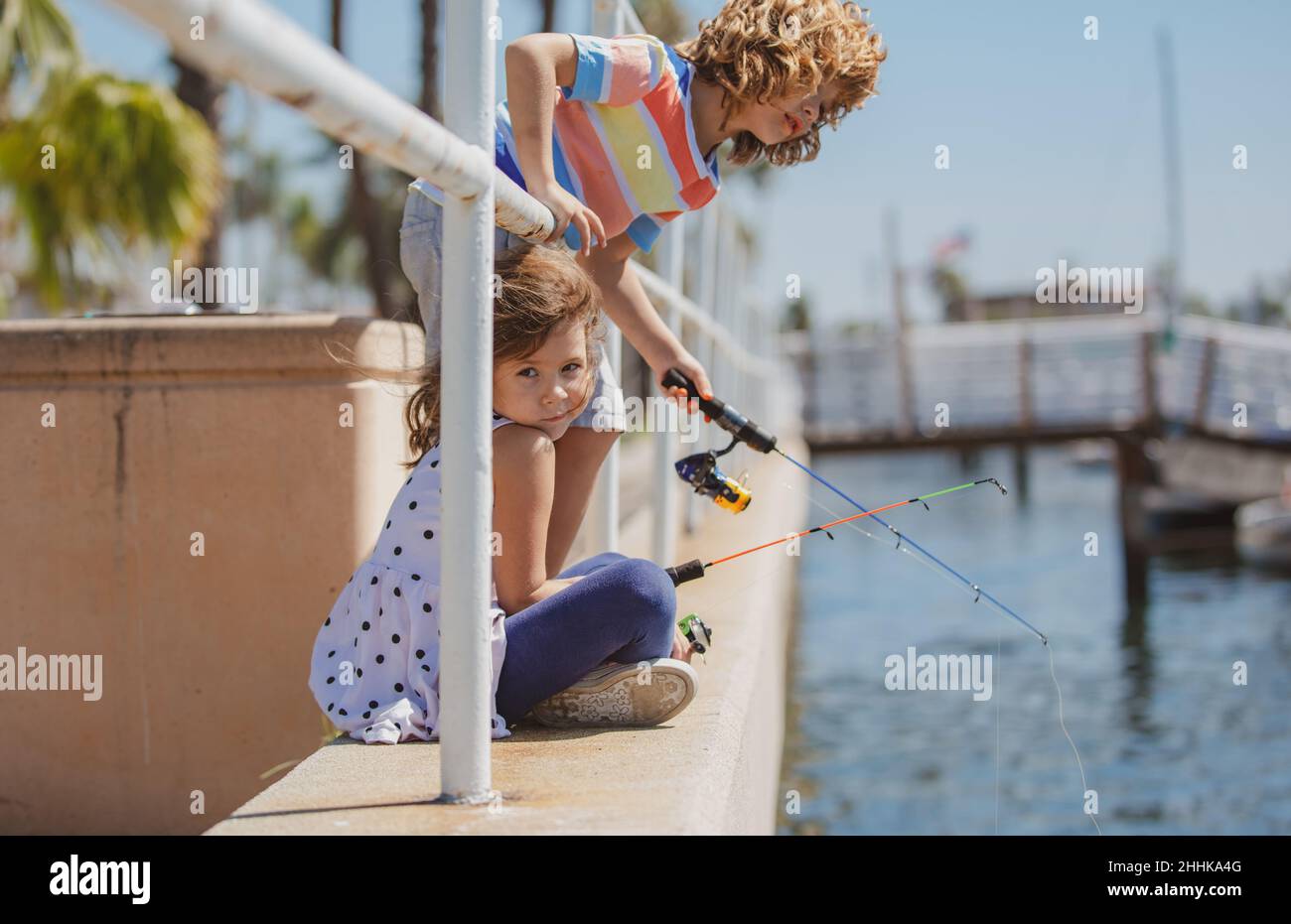 https://c8.alamy.com/comp/2HHKA4G/children-fishing-couple-of-kids-on-pier-child-at-jetty-with-rod-boy-and-girl-with-fish-rod-2HHKA4G.jpg