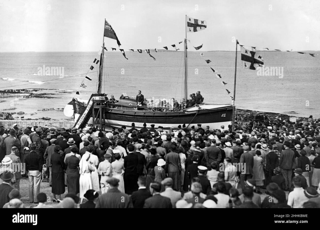 A general view of the launching ceremony of the new North Sunderland motor lifeboat, the 'W.R.A' at Seahouses, Northumberland. 6th September 1936. Stock Photo