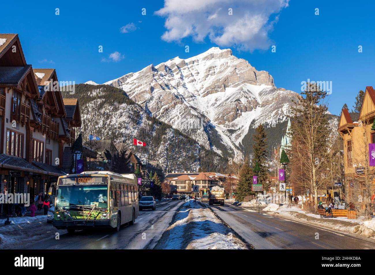 Banff, Alberta, Canada - January 23 2022 : Downtown Banff Avenue in a winter sunny day, during covid-19 pandemic period. Stock Photo
