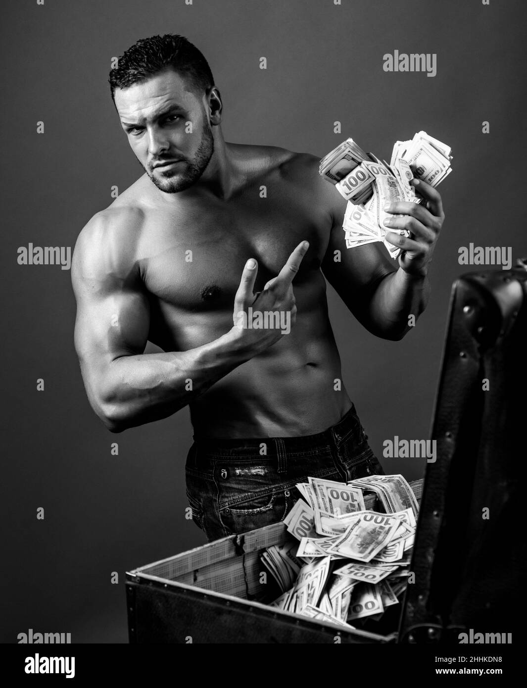 Rich man with cash. Money concept. Brutal guy with dollars. Dollar banknotes. Easy money. Stock Photo