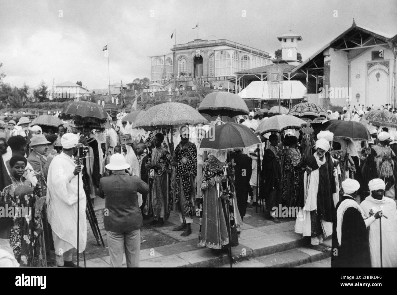 Abyssinian War September 1935Emperor Haile Selassie wearing a heavy crown and white veil with chiefs and other dignitaries, under ceremonial umbrellas, on the steps of the place in Addis Ababa at the beginning of the Meskel festival as Italian force threaten the borders. Stock Photo