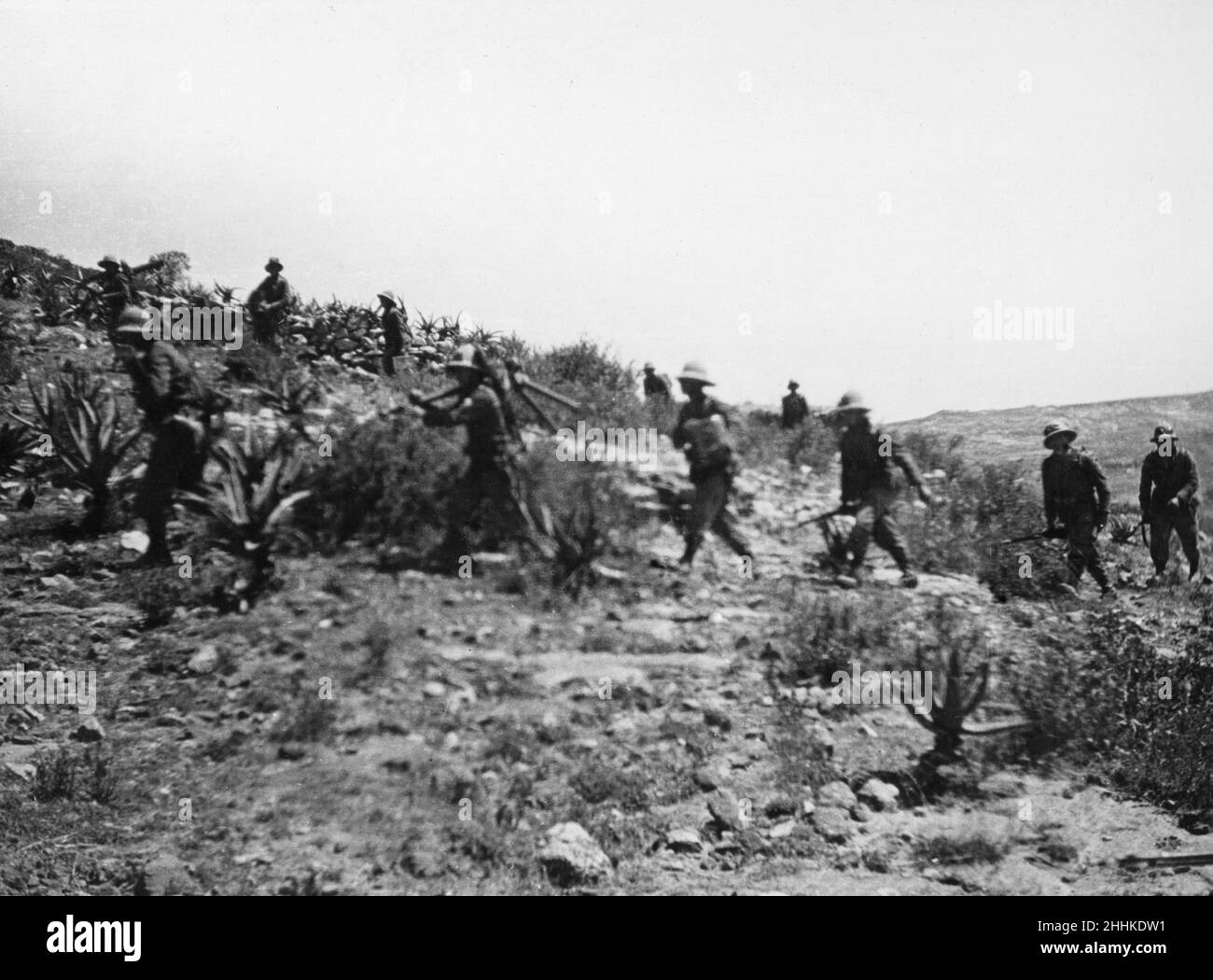 Abyssinian War October 1935Italian infantry with machine guns follow in the wake of the tanks during their advance from Adigrat to Makale Stock Photo